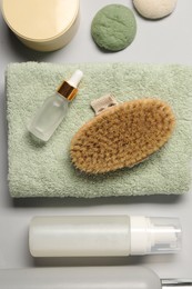 Photo of Bath accessories. Flat lay composition with personal care products on light grey background