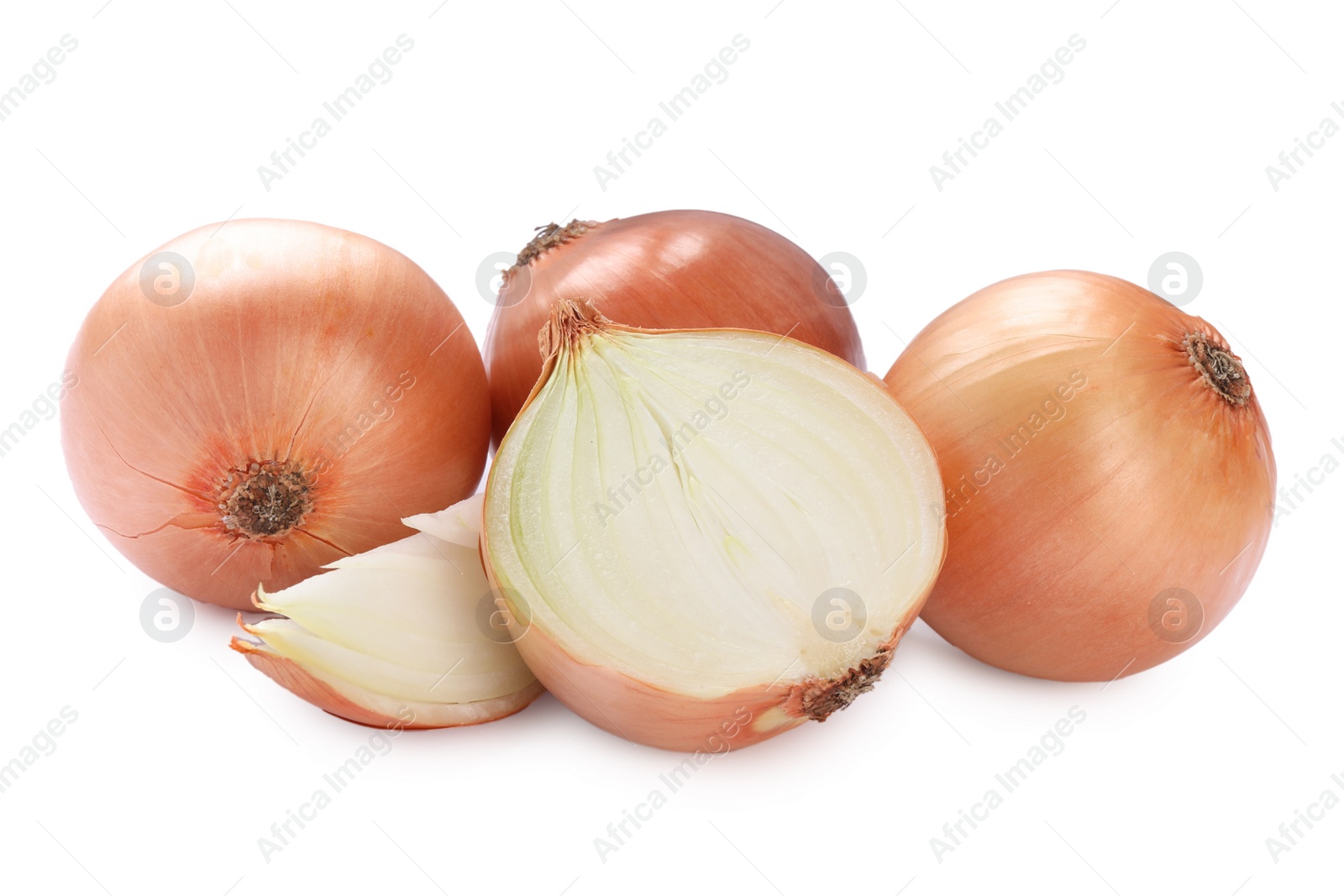 Photo of Whole and cut onions on white background