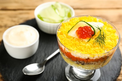 Photo of Traditional russian salad Mimosa served on table