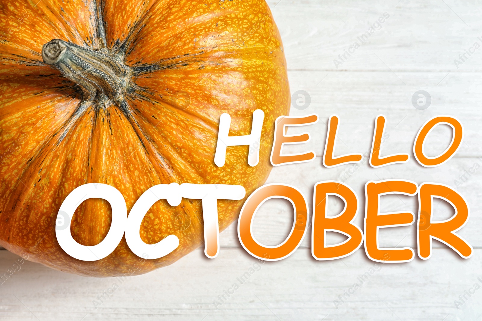 Image of Hello October card. Pumpkin on white wooden background, top view