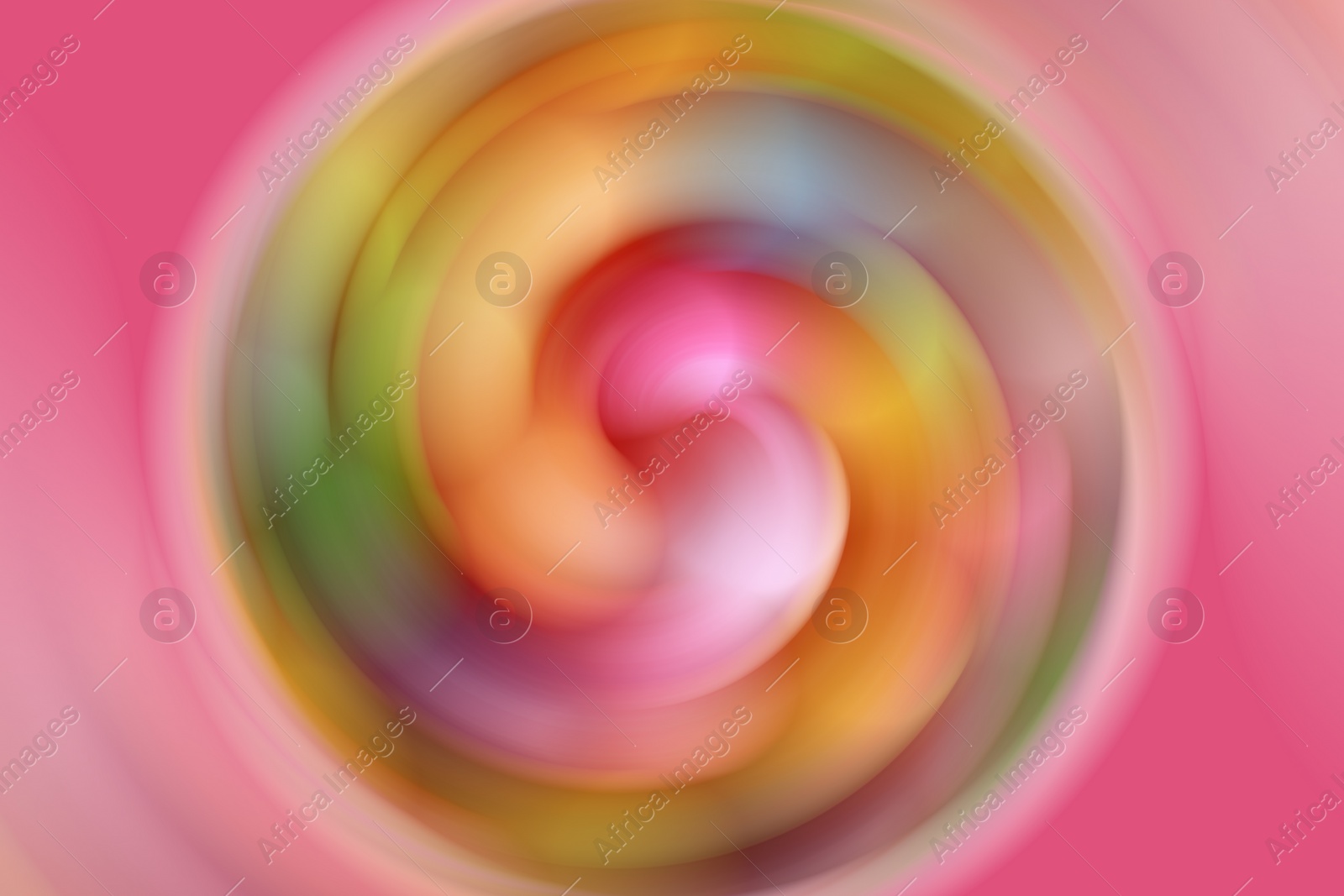 Image of Spinning hard candies as background, motion effect