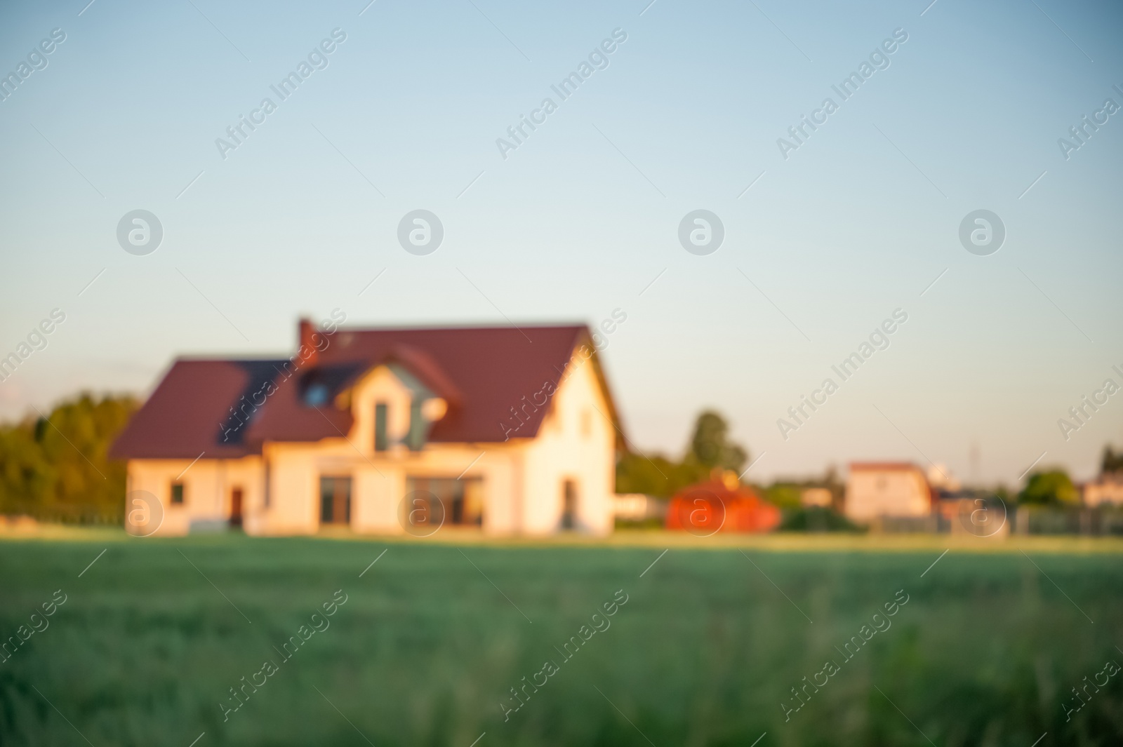Photo of Blurred view of beautiful house on sunny day