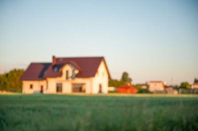 Blurred view of beautiful house on sunny day