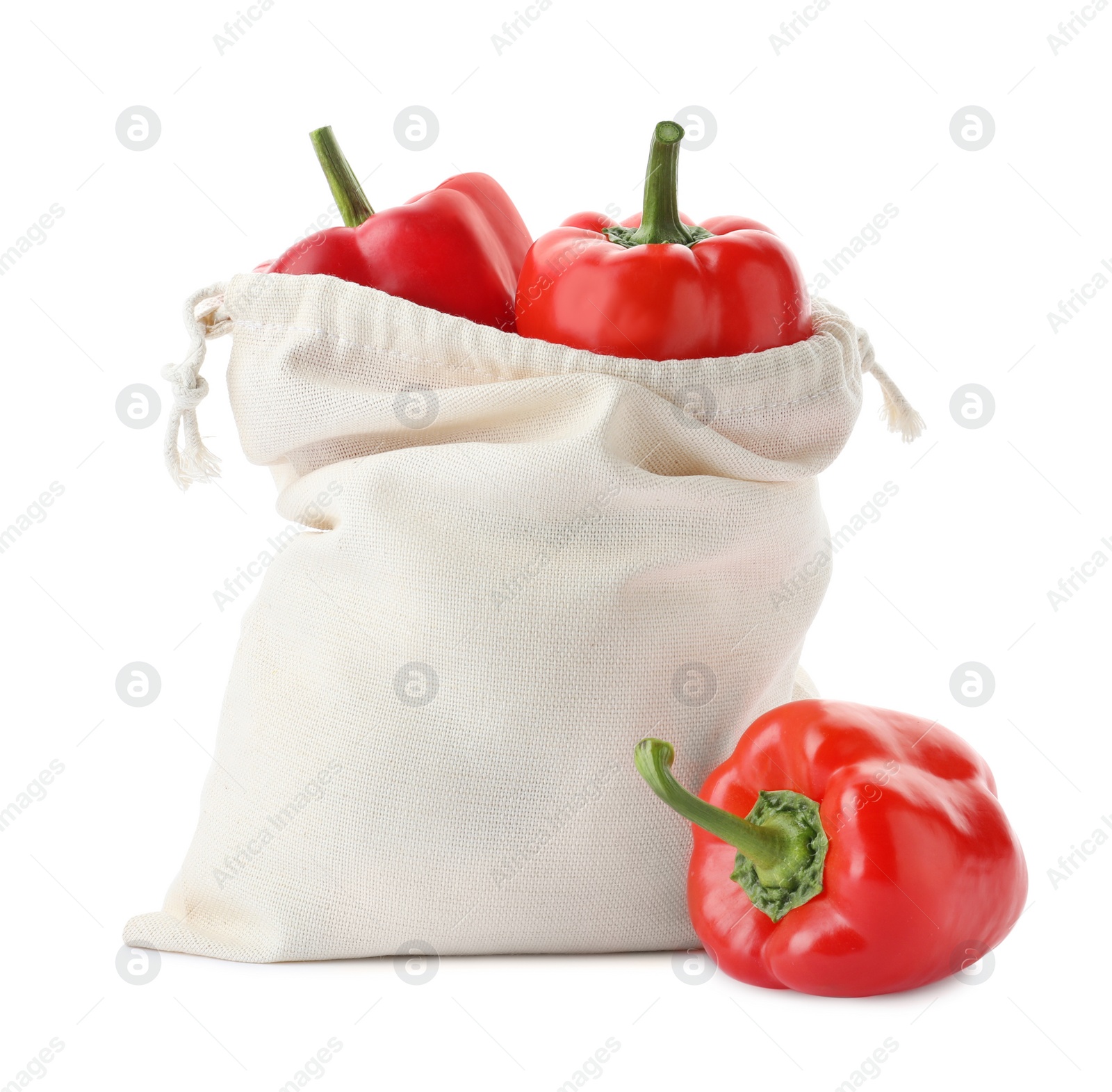 Photo of Cotton eco bag with bell peppers isolated on white