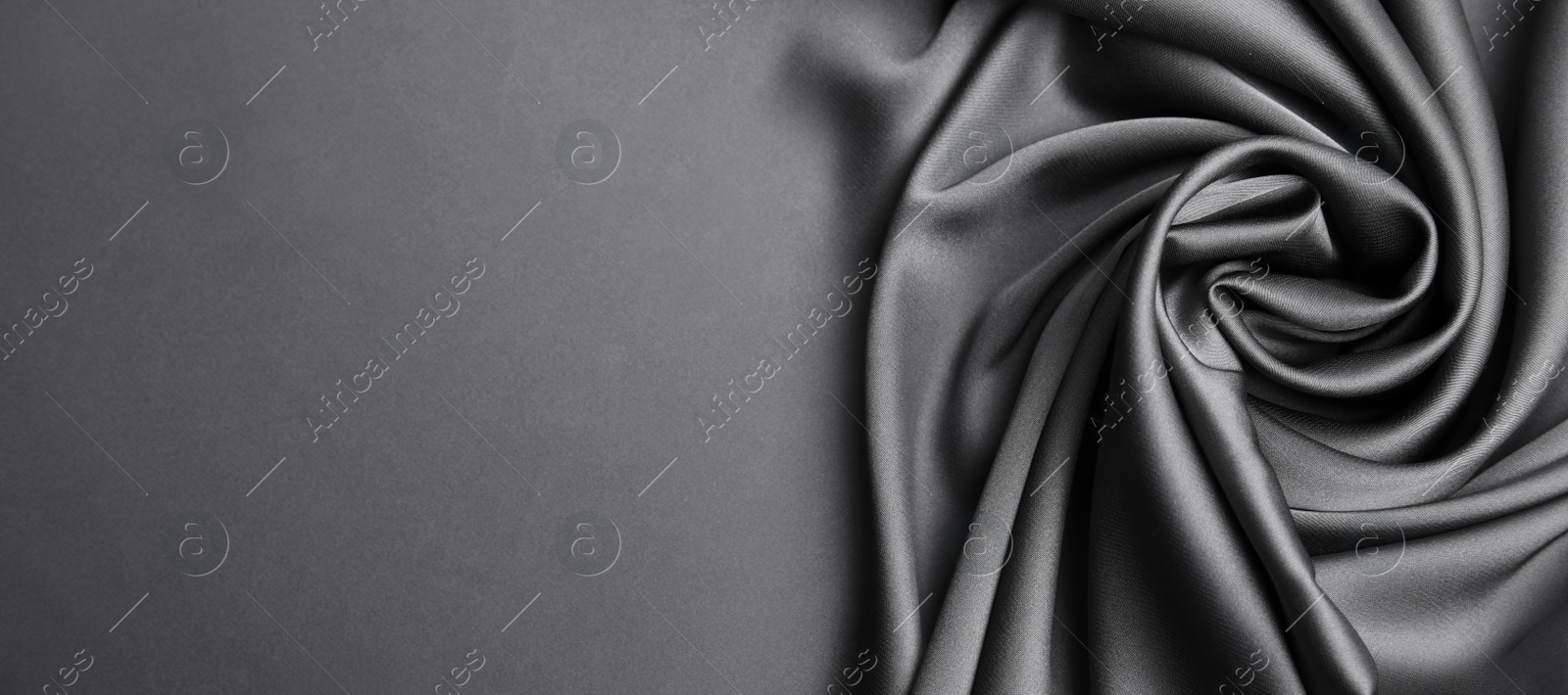 Image of Grey silk fabric as background, top view with space for text. Banner design