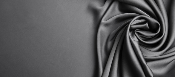 Image of Grey silk fabric as background, top view with space for text. Banner design