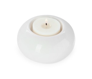 Photo of Burning candle in holder isolated on white