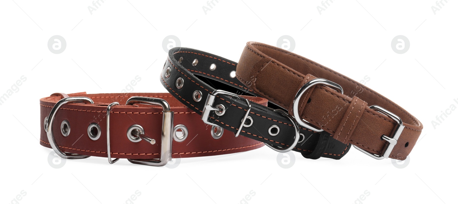 Photo of Different leather dog collars on white background