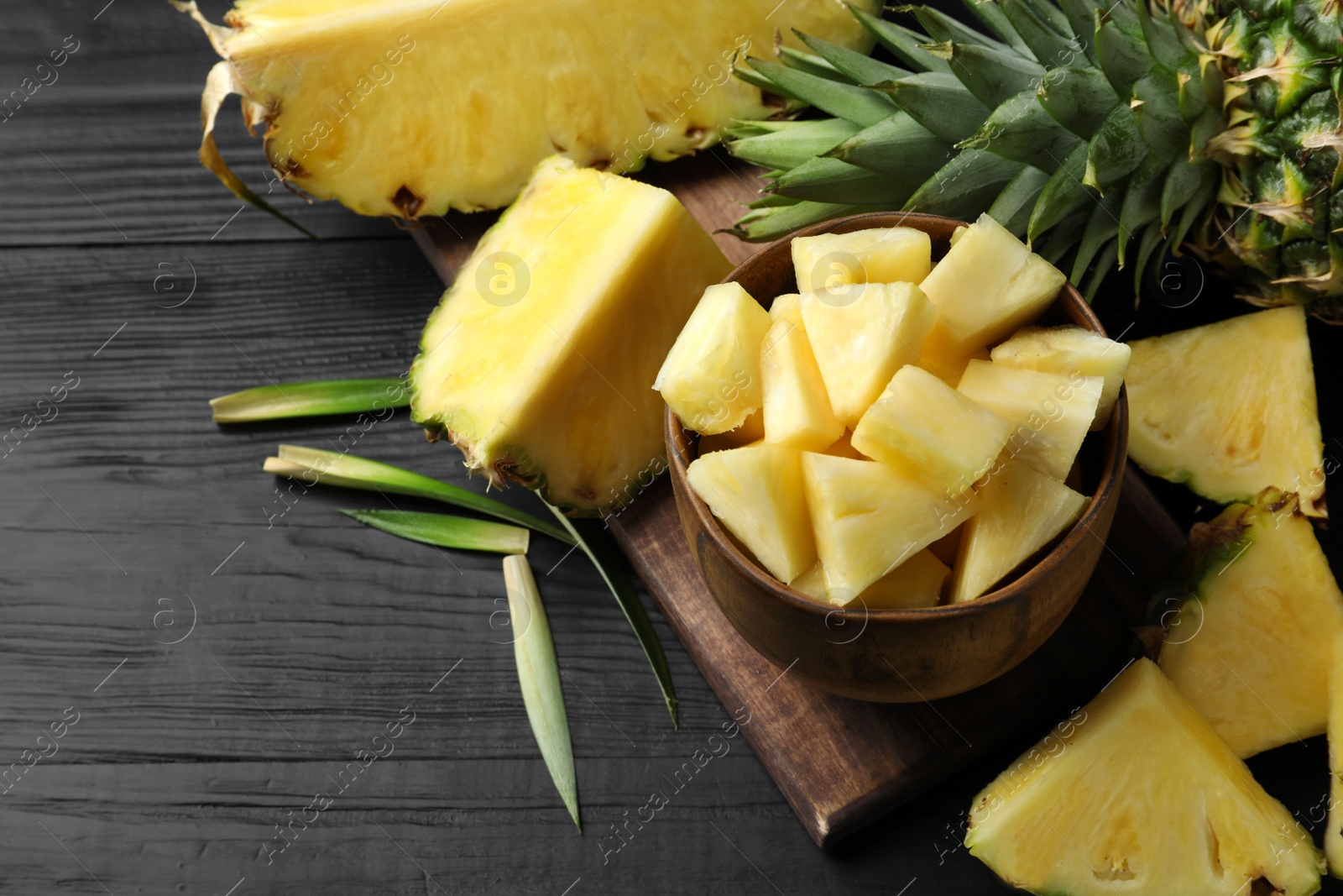 Photo of Composition with fresh sliced pineapple on table