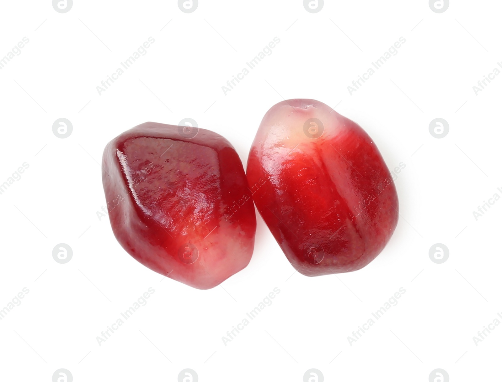 Photo of Ripe juicy pomegranate grains isolated on white, top view