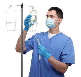 Photo of Nurse setting up IV drip on white background