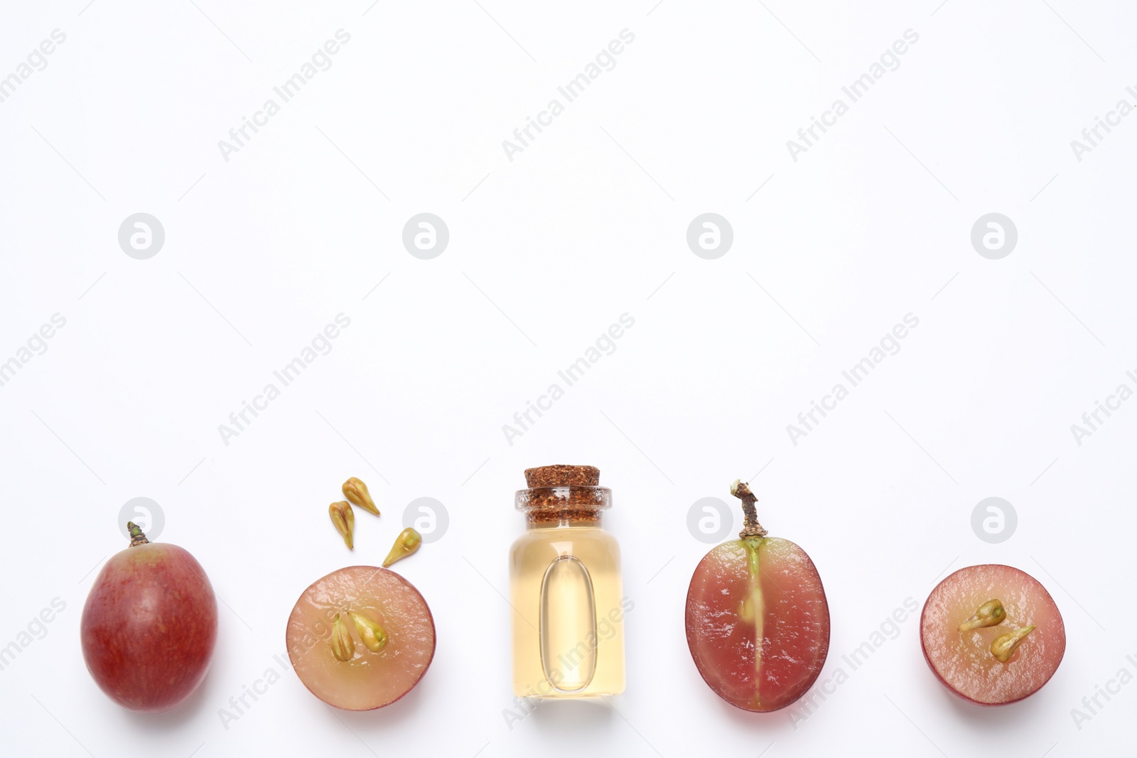 Photo of Composition with natural grape seed oil on white background, top view. Organic cosmetic