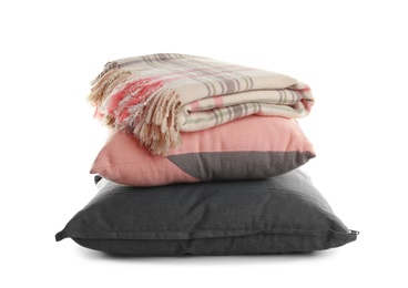 Photo of Stylish soft pillows and folded plaid on white background