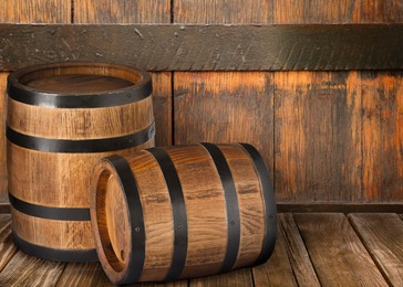 Image of Barrels on wooden background, space for text