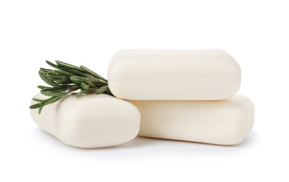 Photo of Soap bars and rosemary on white background