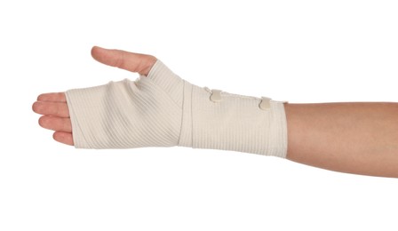 Photo of Woman with hand wrapped in medical bandage on white background, closeup