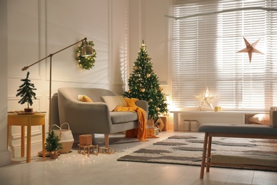 Photo of Stylish room with Christmas decorations. Festive interior design