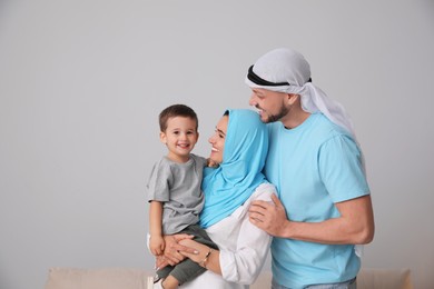 Photo of Happy Muslim family spending time together at home