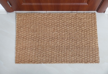 Photo of New clean mat near entrance door, top view