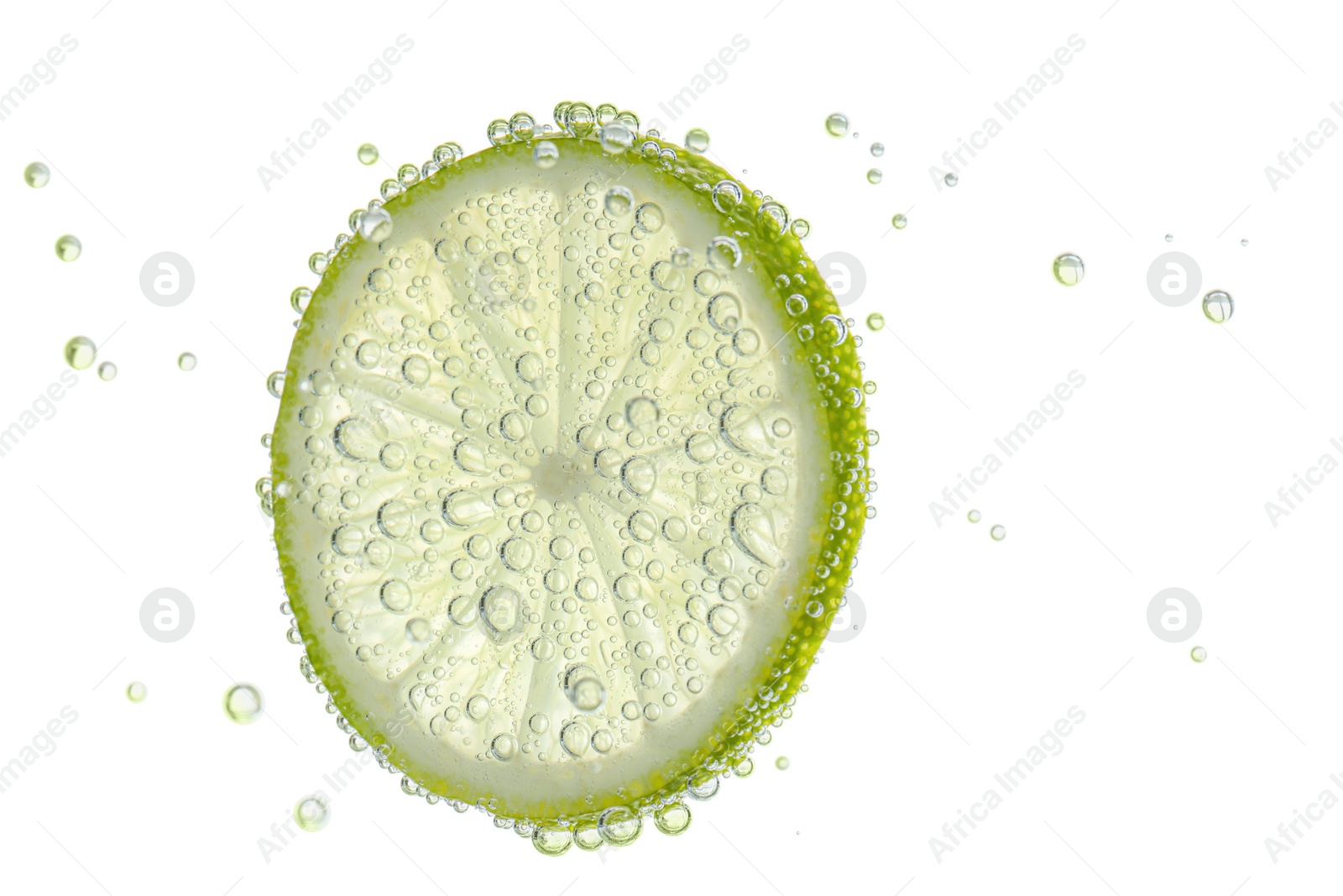 Fresh lime slice in sparkling water on white background Photo of Fresh lime slice in sparkling water on white background