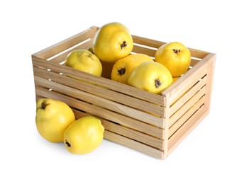 Photo of Wooden crate with delicious fresh ripe quinces isolated on white