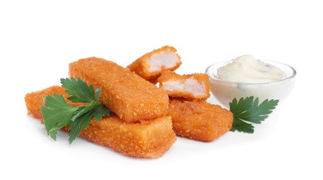 Photo of Fresh breaded fish fingers with parsley and sauce on white background