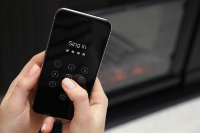 Photo of Woman unlocking smartphone with blocked screen indoors, closeup. Space for text