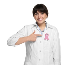 Mammologist pointing at pink ribbon on white background. Breast cancer awareness