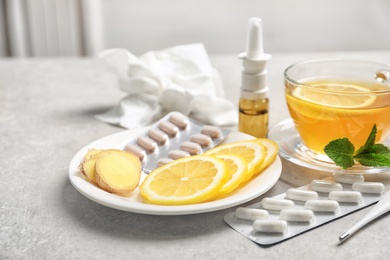 Photo of Natural and medical cold remedies on table
