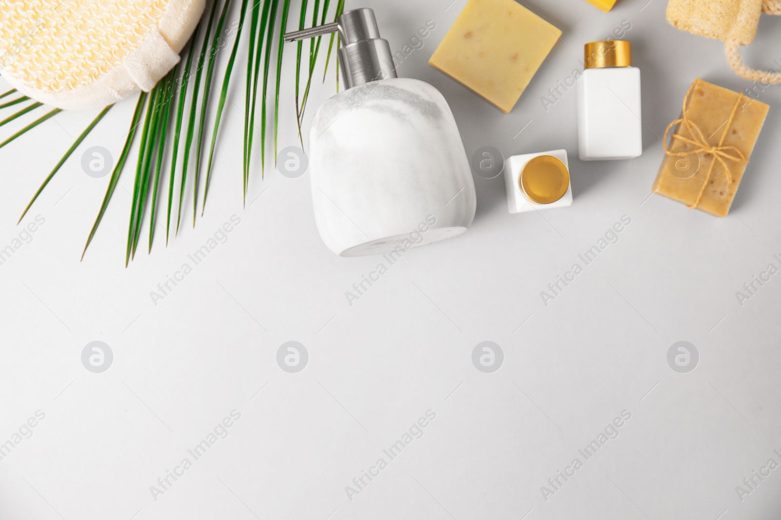 Photo of Flat lay composition with marble soap dispenser on white background. Space for text