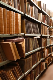 Image of Collection of different books on shelves in library