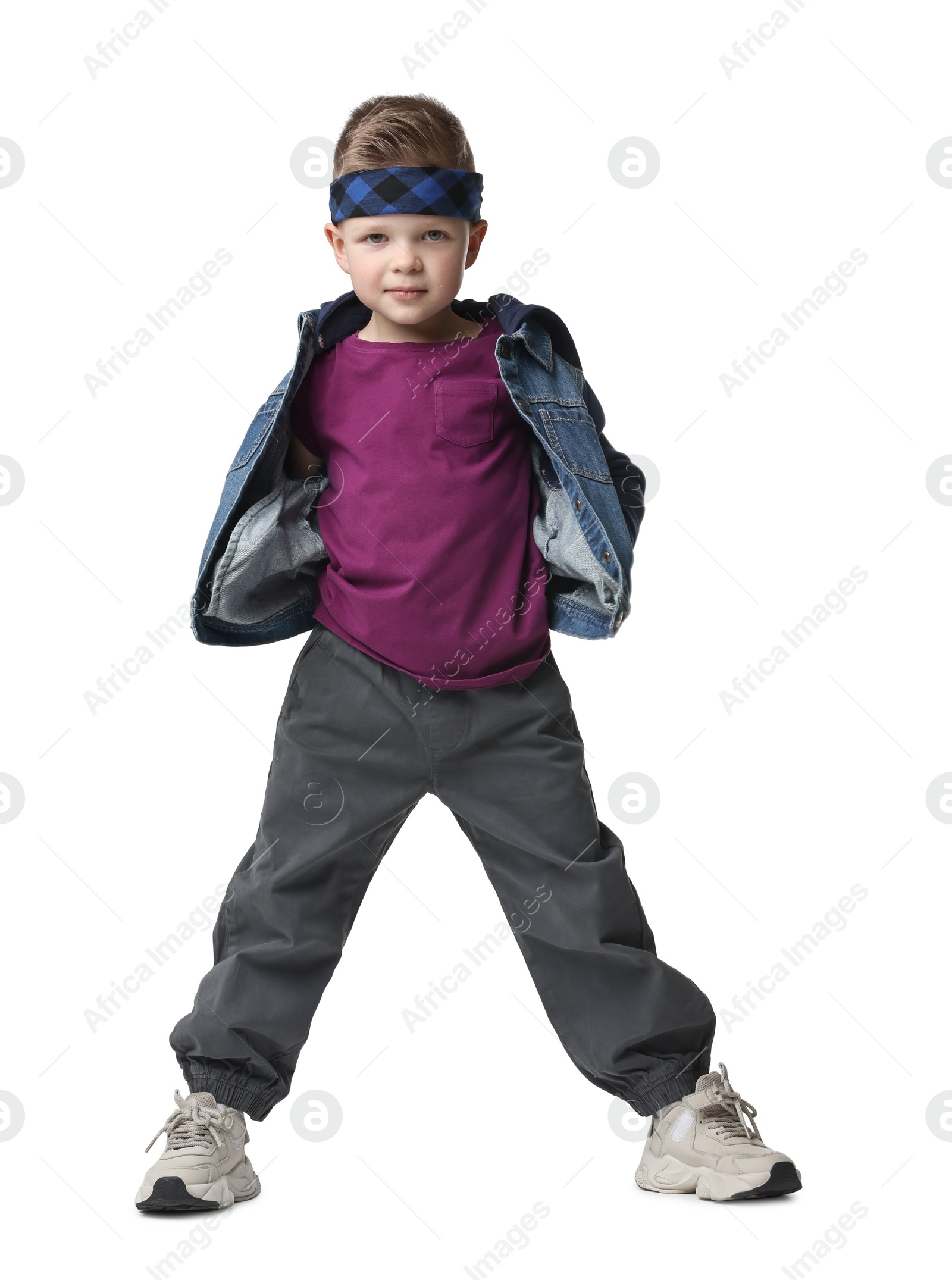 Photo of Happy little boy dancing on white background