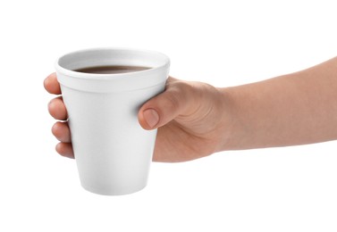 Photo of Woman holding styrofoam cup with coffee on white background, closeup