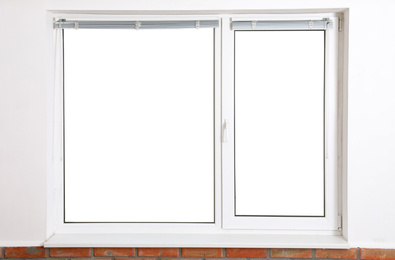 Photo of Modern window with blinds in empty room