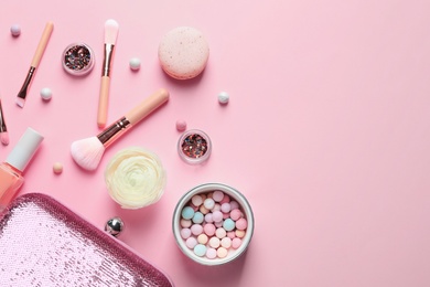 Photo of Makeup products with cosmetic bag on color background