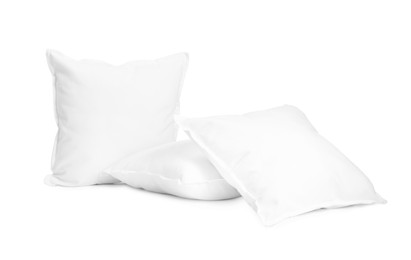 Photo of Three new soft pillows isolated on white
