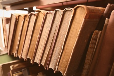 Image of Collection of old books in library, closeup