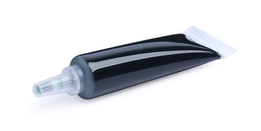 Photo of Tube with green food coloring on white background