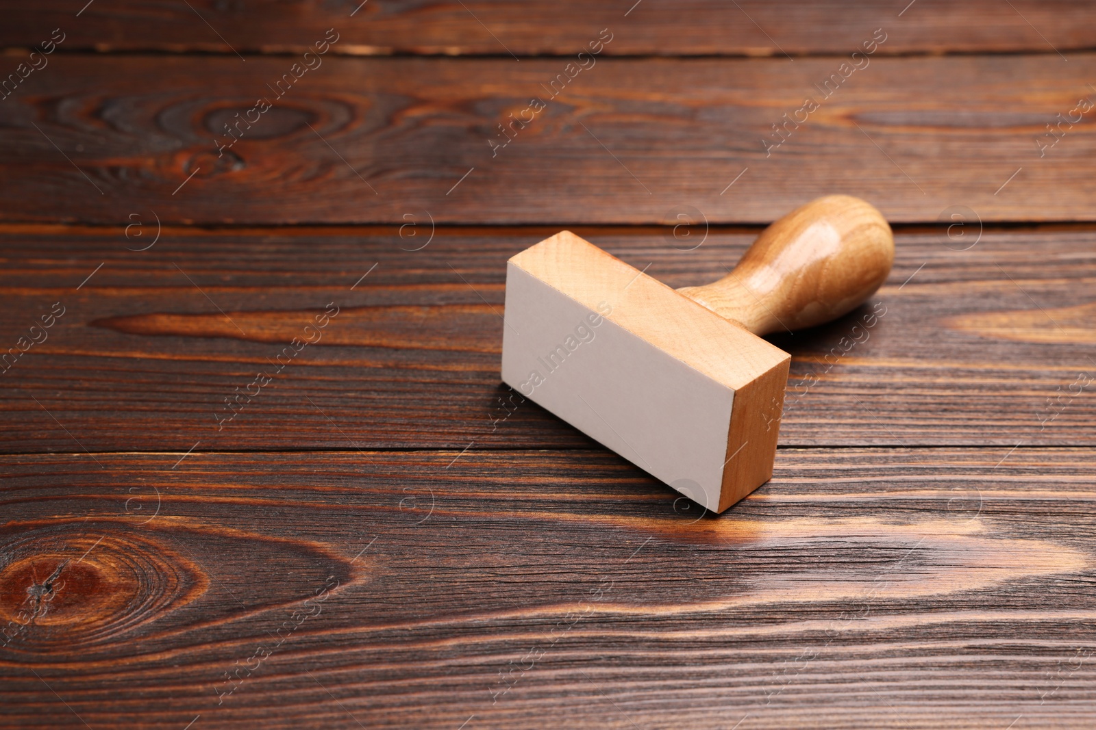 Photo of One stamp tool on wooden table, space for text