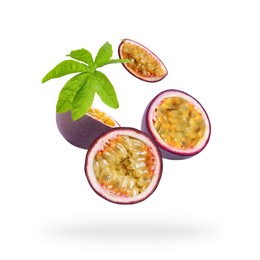 Image of Tasty passion fruits and passiflora leaf falling on white background