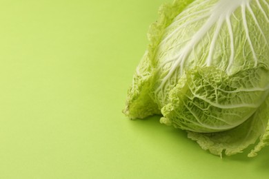 Photo of Fresh ripe Chinese cabbage on light green background. Space for text