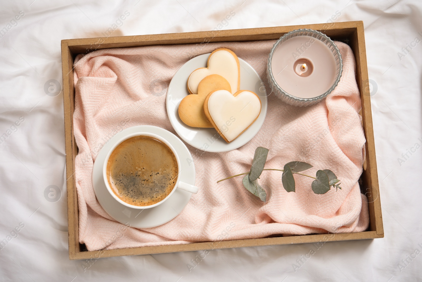 Photo of Aromatic coffee and cookies on bed, flat lay. Romantic breakfast