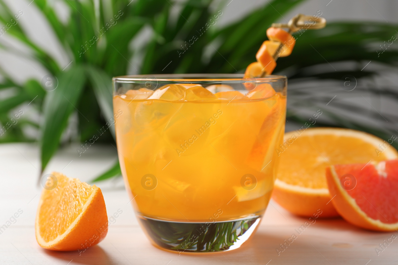 Photo of Delicious orange soda water on white table