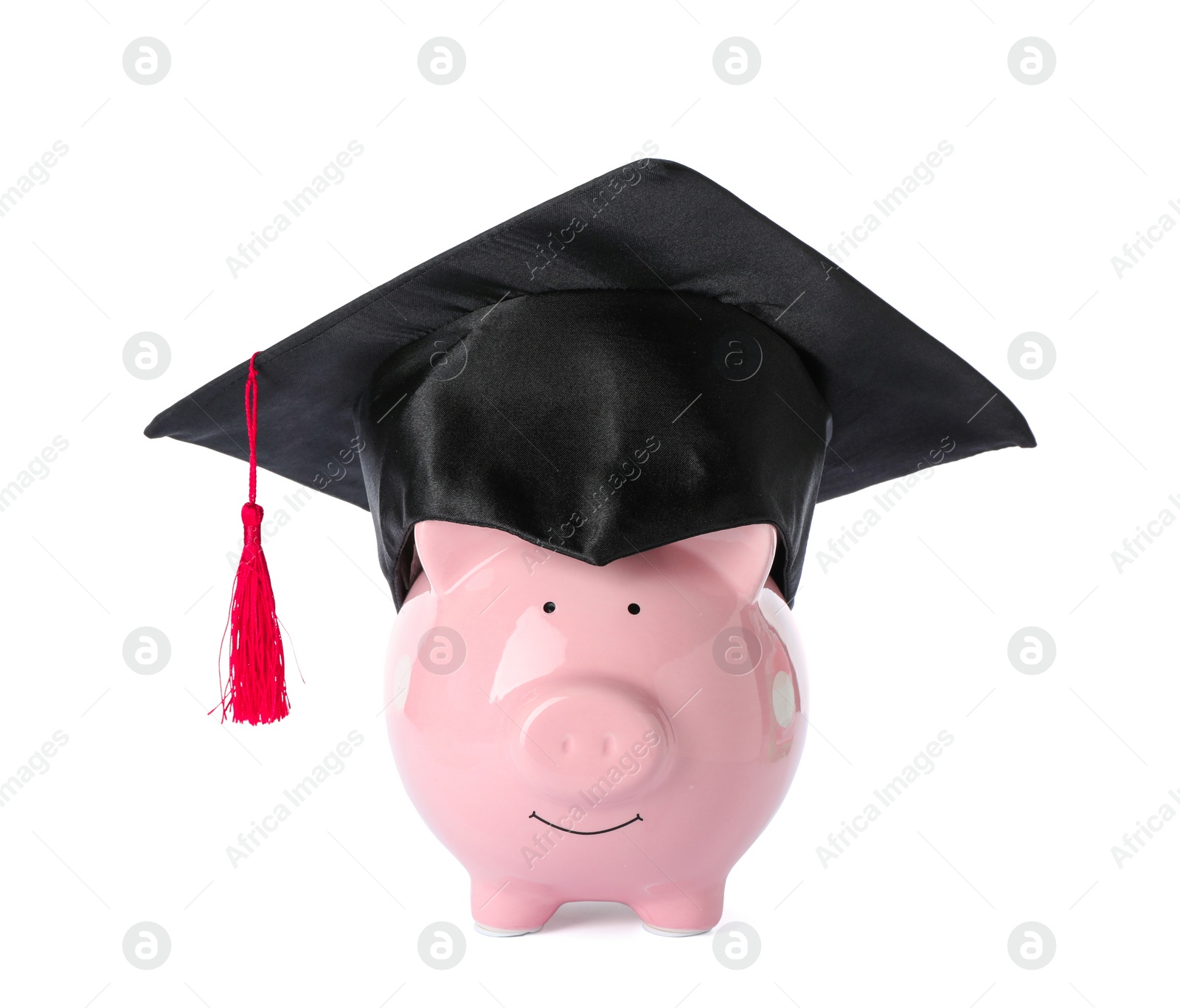 Photo of Piggy bank with graduation hat isolated on white