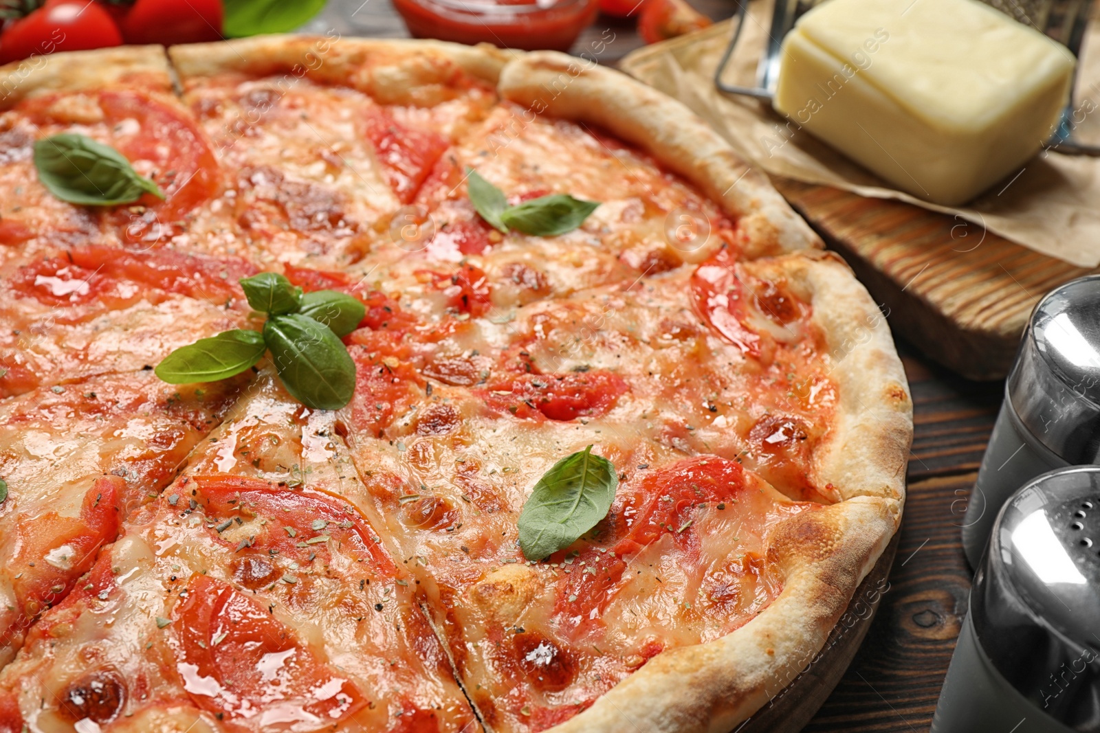 Photo of Delicious pizza Margherita on wooden table, closeup view