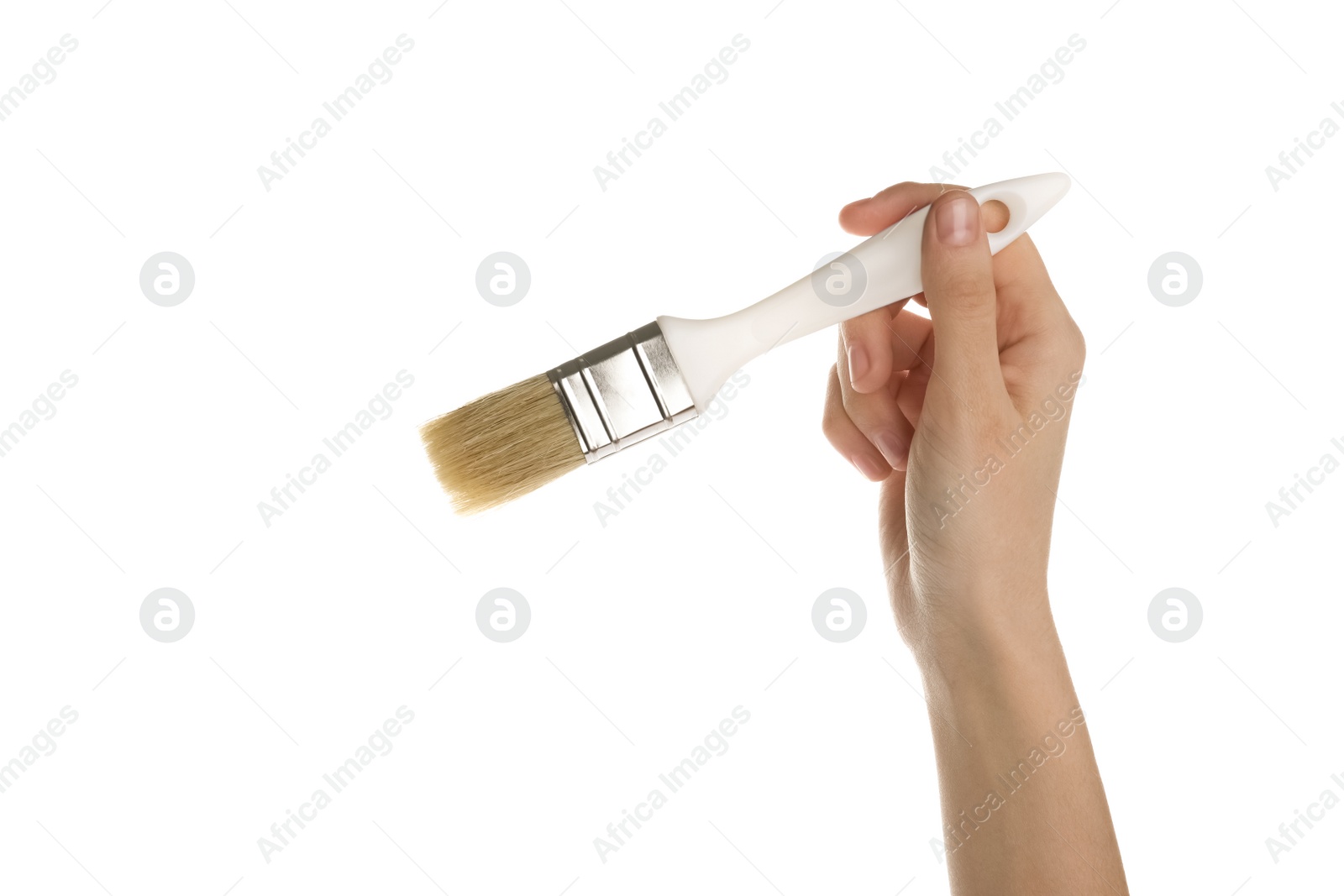 Photo of Woman holding paint brush on white background, closeup