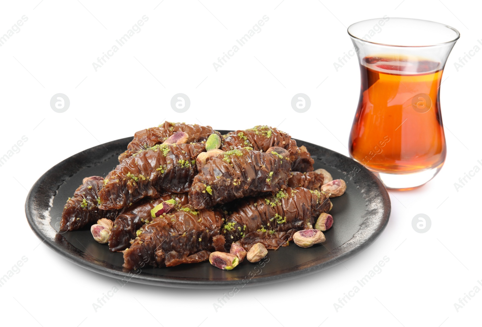 Photo of Delicious baklava with pistachios and hot tea on white background