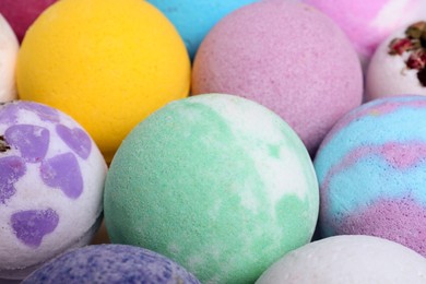 Photo of Colorful bath bombs as background, closeup view