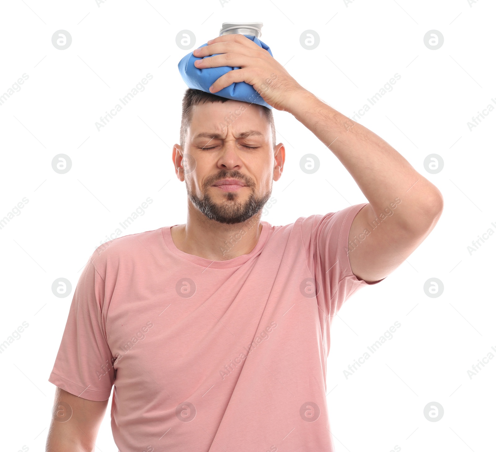 Photo of Unhappy man using cold pack to cure headache on white background