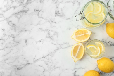 Flat lay composition with delicious natural lemonade on marble background